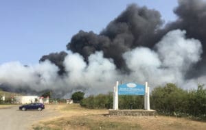 Smoke from landfill fire drifts toward the airport and Frederiksted Sunday afternoon. (Source photo by Susan Ellis)