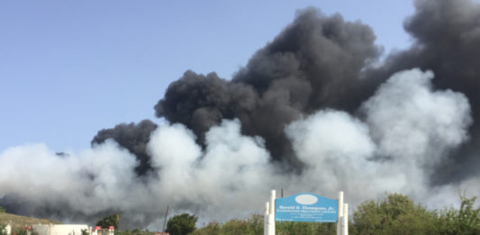 Smoke from landfill fire drifts toward the airport and Frederiksted Sunday afternoon. (Source photo by Susan Ellis)