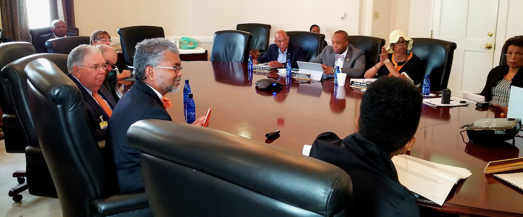 A panel of Oriental Bank representatives meet with the Virgin Islands Banking Board to discuss their request of a permit. (Source photo)