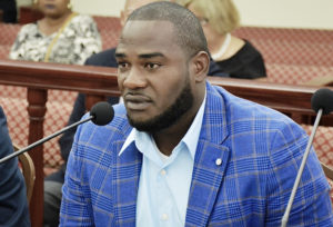 Royson Fabien, owner of Fabien Trucking LLC, tells senators about his plans to improve the government land he hopes to rent. (Photo by Barry Leerdam, USVI Legislature)