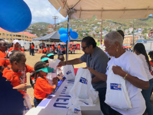 Volunteers distribute school supplies to students during the 2018 fundraising event. (Submitted photo)