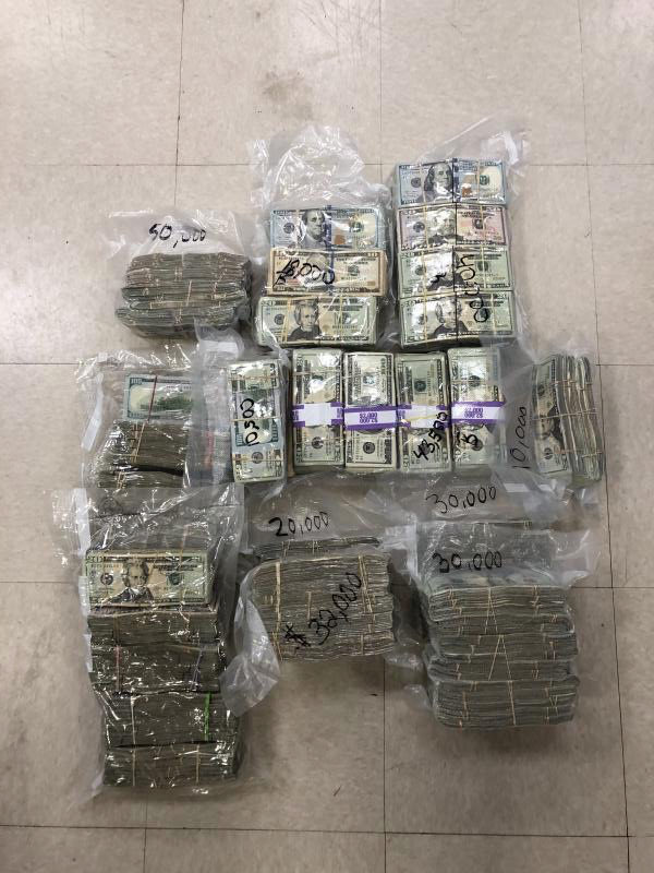 Bundles of vaccuum-packed cash found by federal agents on a beached boat on St Thomas. (Customs and Border Patrol photo)
