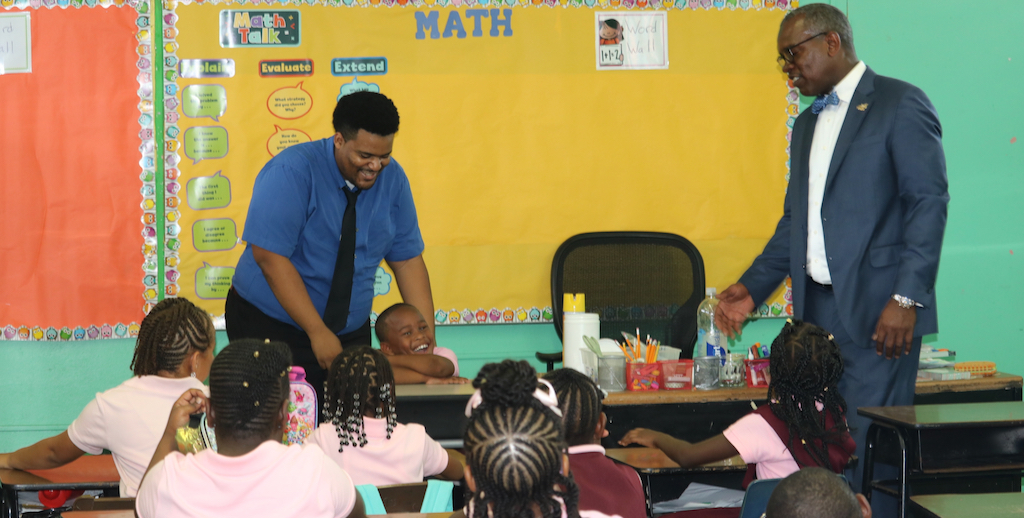 Gov. Albert Bryan Jr., right, joins students and teachers at Pearl B. Larsen School for the first day of school. (Department of Education photo)