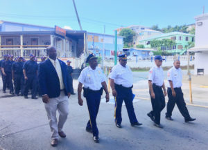 STJ officials lead fire cadets through Cruz Bay for the 9/11 commemoration, (Source photo by Amy Roberts)
