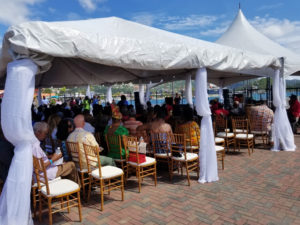 The audience sits under large tents in the center of Crown Bay’s Austin Monsanto Terminal for the speeches and engertainment. (Source photo by Bethaney Lee)