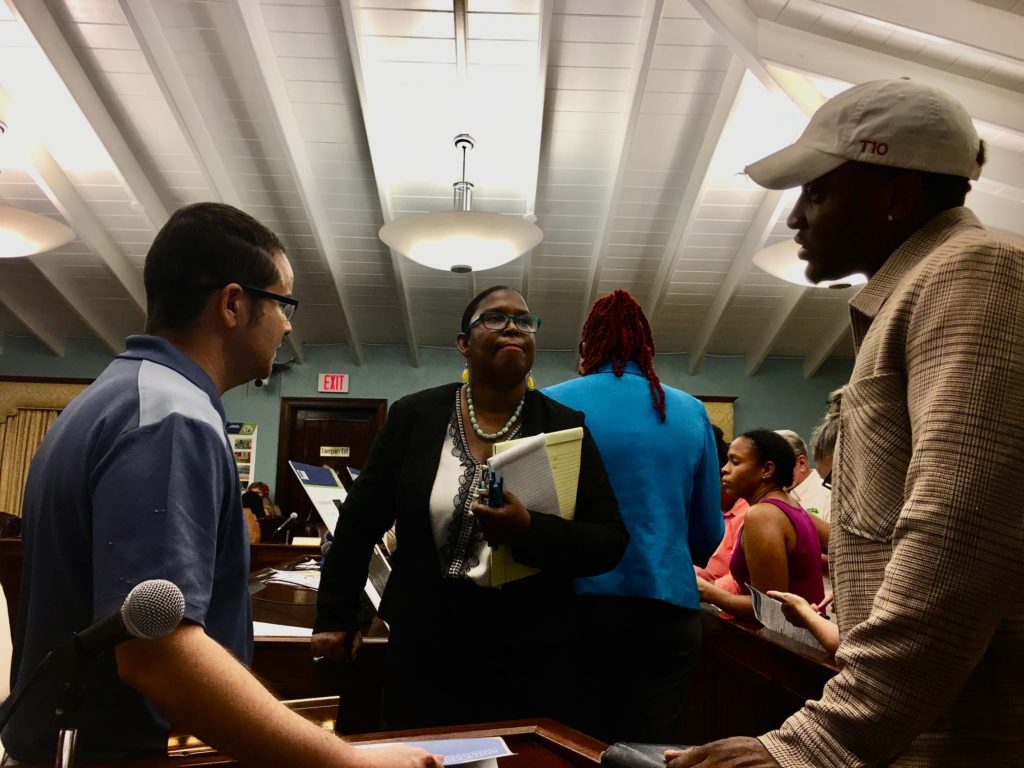 Eric Adams, FEMA public affairs officer, talks to architect Chaneel Callwood and Lawrence Williams, public assistance task force lead for education with FEMA. (Source photo by Amy Roberts)