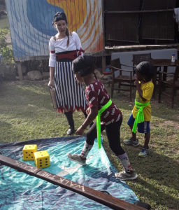 Children walk the plank to find clues in Shark’s Mouth. (Source photo by Darshania Domingo)