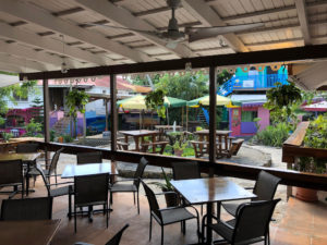 In addition to the spacious bar area, Whiskey Business offers al fresco dining and umbrella-topped table seating. (Source photo by Teddi Davis)