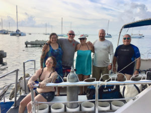 Adaptive diving graduates and their support team: Hannah Gray, guinea pig; Jackie Weichman, graduate; Jeff Dykstra, graduate; Barbara DeClerque, instructor; Greg Gapen, graduate observer. (Photo by Michelle Peugh)