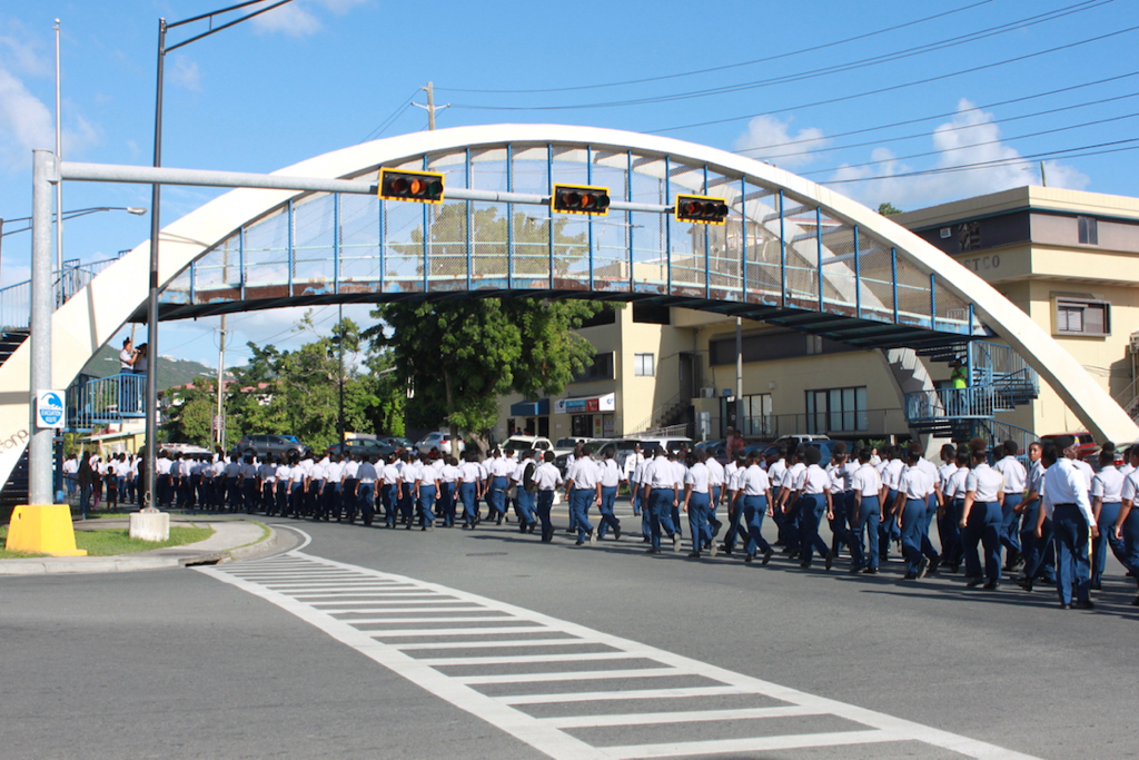 Charlotte Amalie High School parades down Veterans Drive in St. Thomas with over 100 students joined in a unison march. (Source photo by Bethaney Lee)