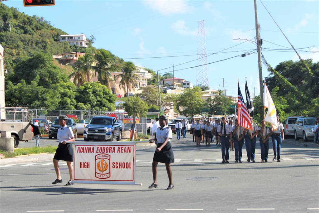 Ivanna Eurdora Kean High School JROTC are in their dress blues marching down Veterans Drive in St. Thomas. (Source photo by Bethaney Lee)
