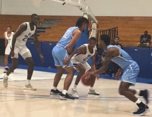 Tavion Pierson fights through a screen during UVI’s loss on Friday Night Against Keiser University. (Source photo by Kyle Murphy)