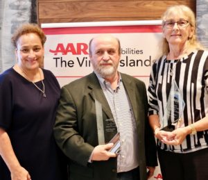 AARP CEO Jo Ann Jenkins, left, presented the Andrus Award Tuesday to Scott Bradley and Alma Winkfield. (Source photo by Linda Morland)