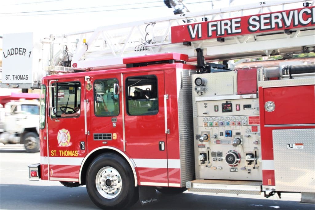 A Virgin Islands Fire Services truck is driven down the Waterfront in St. Thomas. (Source photo by Bethaney Lee)