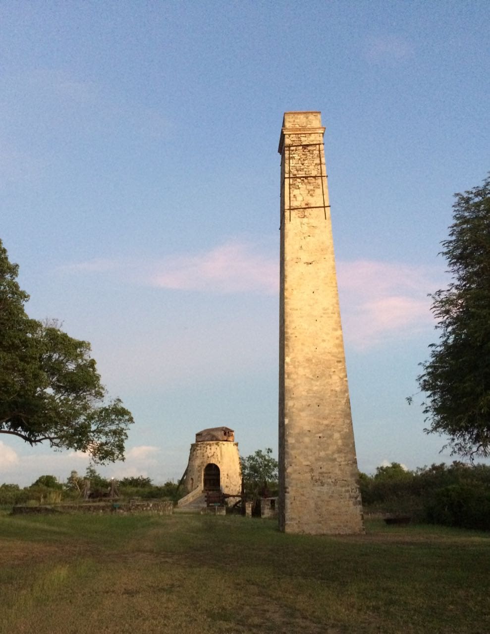The windmill and the factory chimney at the Whim Museum await repairs. (Source photo by Don Buchanan)