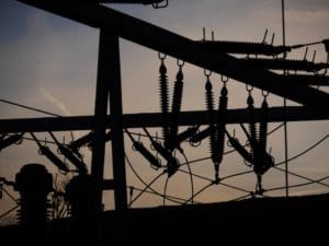 Electric power grid in silhouette. (Shutterstock image)