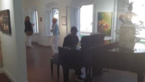 Upstairs Gallery with music and Bamboula Woman by Waldemar Brodhurst. (Source photo by Darshania Domingo)