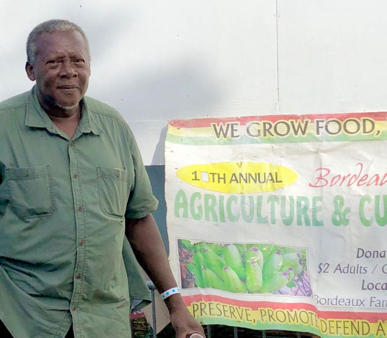 Eldridge Thomas, president of We Grow Food Inc., encouraged people at the Bordeaux Food Fair to plant trees and gardens. (Source photo by Gal Karlsson)