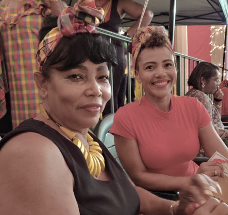 Mercedes Navarro and Kristin Davis enjoy the evening at the Dorsch Center in Frederksted. (Source photo by Denise Lenhardt-Benoit)