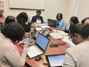 JFL administrative staff join board member Dr. Olivine Treasure for a Territorial Hospital Board meeting. (Source photo by Susan Ellis)