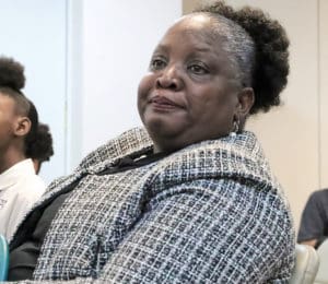 In October, Valrica Miranda Maria Bryson listens while she's praised at the meeting of the Senate Committee on Culture, Historic Preservation, and Aging. (File photo by the USVI Legislature)