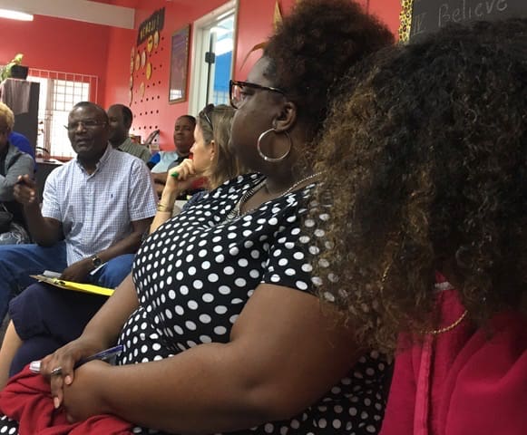 The Rev. Eloi Sylvester speaks to the group about trauma and recovery. (Source photo by Susan Ellis)