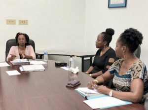 At left, Leia LaPlace, territorial planner for the V.I.Department of Planning and Natural Resources Comprehensive and Coastal Zone Planning, hears rezoning requests at the DPNR office in Frederiksted. (Source photo by Susan Ellis)