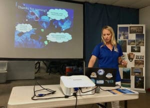 Erin Muller of the Mote Marine Laboratory talks about coral reef diseases last week. (Source photo by Susan Ellis)