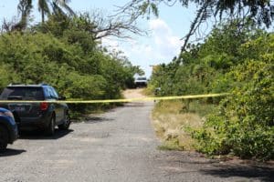 Police and the medical examiner respond to Good Hope Beach where the body of Jahkim E. Santiago was found in the water. (VIPD photo)