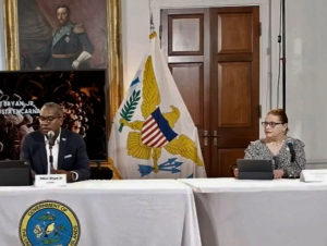 Gov Albert Bryan Jr and Health Commissioner Justa Encarnacion keep their distance during Friday's news conference. (Image captured from Government House live stream)