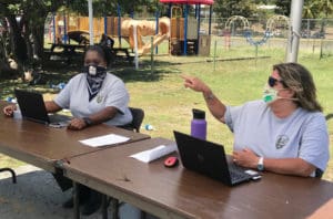 Andrea Joseph and Laurel Brannick take registration from boaters at the NPS on St. John.