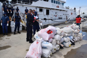 The crew of the Coast Guard Cutter William Trump offloads 1,100 pounds of marijuana, Wednesday, at Sector San Juan. (U.S. Coast Guard photo by Ricardo Castrodad)