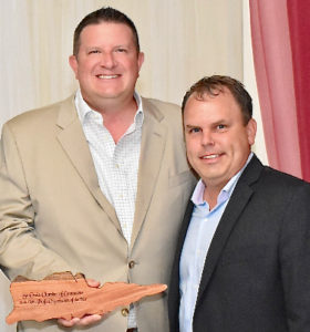 David Johnson, left, and Kirk Chewning, founders and co-owners of Cane Bay Partners, receive the St. Croix Chamber of Commerce's 2019 Nonprofit of the Year Award on behalf of Cane Bay Cares, the charity arm of Cane Bay Partners. (Photo from Cane Bay Partners website)