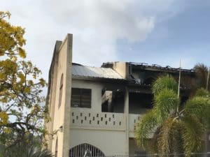 Flames tore through the roof of the Seventh-day Adventist Church in Peter's Rest. (Source photo by Elisa McKay)