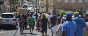 Marchers protesting police brutality and the death of George Floyd at the hands of Minneapolis police pass through Charlotte Amalie. (Source photo by Kyle Murphy)