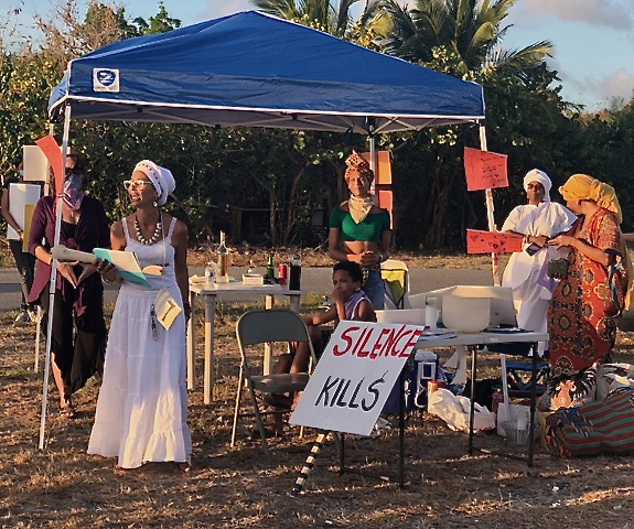 From left, Jennifer Fuentes, Diana Sragosa-Wison (known as Lady D), Zydmarie Sanes, Chenzira Davis-Kahina, Maria Stiles and others helped organize a vigil at the Lagoon Sunday night. (Source photo by Susan Ellis)