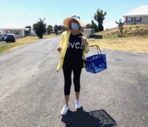 Mary Bartolucci delivers meals in the mid-day sun at Bellevue Village. (Photo provided by Bartolucci)