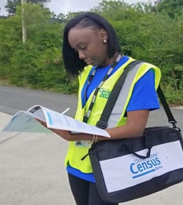 Census workers are wearing royal blue shirts and bright yellow vests, with an ID on a lanyard. (Submitted photo)