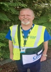 The Census 2020 logo is on the front of both the census taker's yellow vest and blue shirt. (Submitted photo)