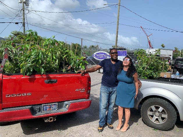 Farmer and volunteer Royce Creque (left) of Green Ridge Guava Berry Farm in Bordeaux on St Thomas and Christina Chanes (right) who is the CGTC program coordinator of the UVI project worked together to give fruit trees to 100 farmers and 250 families across the USVI for increased food security. UVI’s Agriculture Experiment Station (AES) staff helped to support the project assisting with distribution on St. Croix. 