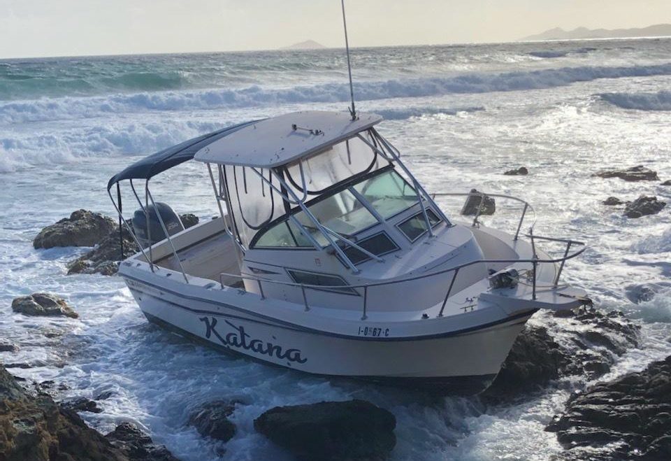 The vessel Katana sits on the rocks off Judith's Fancy, St. Croix, on Monday. Nine people were rescued from the boat on Sunday evening after it ran out of fuel, according to the Coast Guard. (Photo courtesy of U.S. Coast Guard District 7 PADET San Juan)