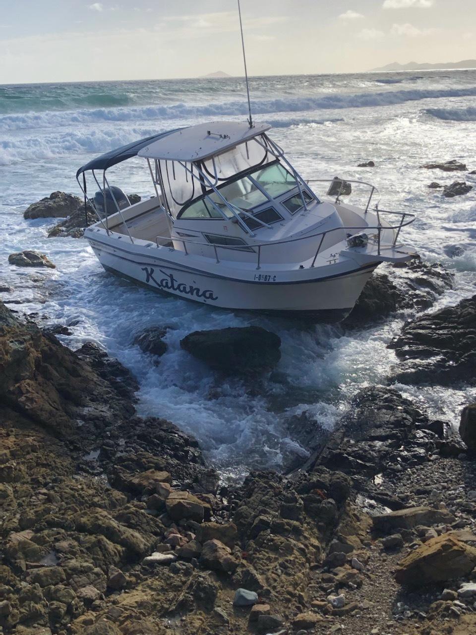 The vessel Katana sits on the rocks off Judith's Fancy, St. Croix, on Monday. Nine people were rescued from the boat on Sunday evening after it ran out of fuel, according to the Coast Guard. (Photo courtesy of U.S. Coast Guard District 7 PADET San Juan)
