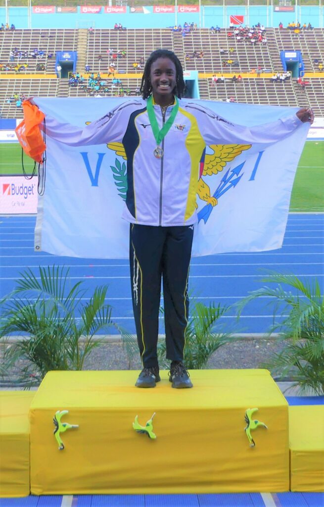 Michelle Smith celebrates her gold-medal, record-setting win in the 200m hurdles at the CARIFTA games in Kingston, Jamaica. (Photo courtesy of Michelle Smith)