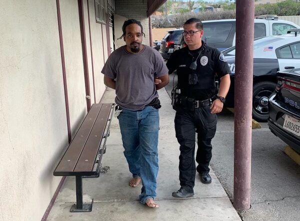 Tyler Delroy Smith is escorted by a police officer following his arrest for first-degree murder on Monday in California. (Photo courtesy of the VIPD)