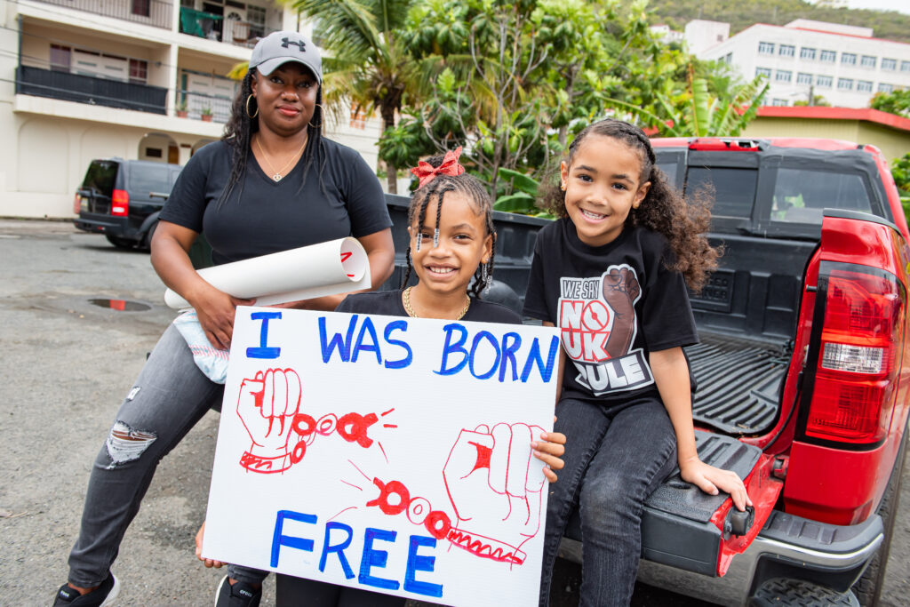 Children join the protest against a British proposal to impose direct rule on the British Virgin Islands on Monday on Tortola. (Photo by Cleave)