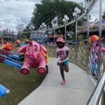 Leah, 7 years old, a happy customer, leaving the elephant go-round at the 50th AgriFest in St. Croix