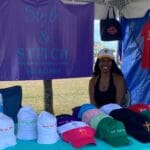 Shayla Cornelius, co-owner of Style & Stitch enjoys a minin break between patrons at the 50th AgFair in St. Croix.