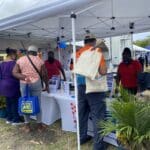 VI Economic Development Authority staff provides information on programs and services with local small business owners and patrons at the 50th Agricultural Fair in St. Croix