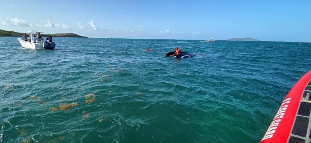 A Coast Guard Boat Forces Detachment boat crew and two Good Samaritan vessels rescue five persons following a vessel capsizing offshore from Green Cay Marina in St. Croix, U.S. Virgin Islands July 17, 2022. Rescued are three men and two women, after a 21-foot pleasure craft capsized when hitting a wave at high speed. (U.S. Coast Guard photo)