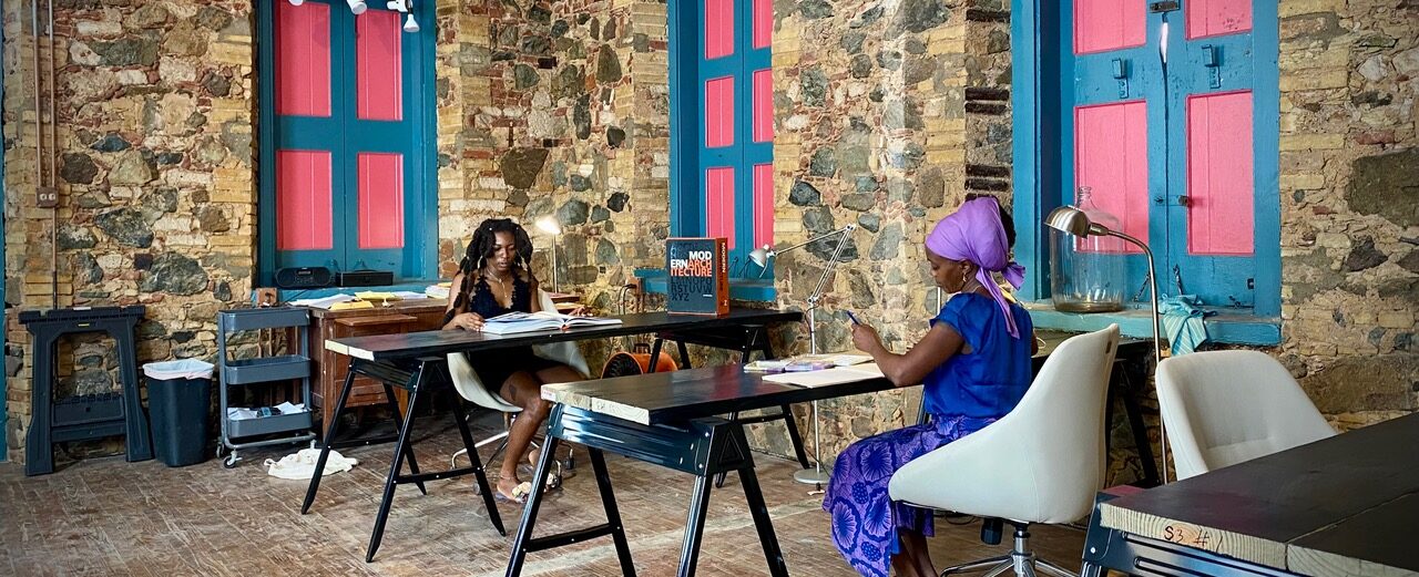 Artists Mwamini Frett and Montex Teferi work in the new 81C Artist Studio space, located in the historic Pissarro House on Main Street, Charlotte Amalie. (Photo by 81C)